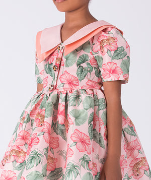 Close-up detail of the Mahe Lotus Floral Girls Dress highlighting the lotus-inspired floral print, soft pink Peter Pan collar, and premium lightweight woven fabric texture, fully cotton lined and ideal for festive events, family photos, and elegant celebrations for ages 3–12.