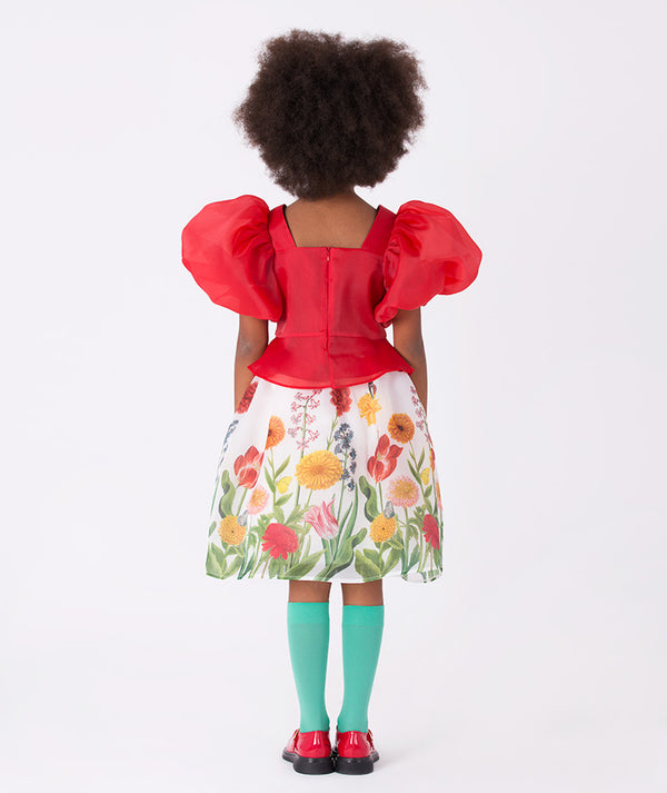 Back view of Mama Luma’s Asagao Flowers Outfit | 2 Pieces showing a red organza top and colorful botanical skirt — perfect for holiday celebrations and winter photoshoots. Available in girls’ sizes 3–12 Y.