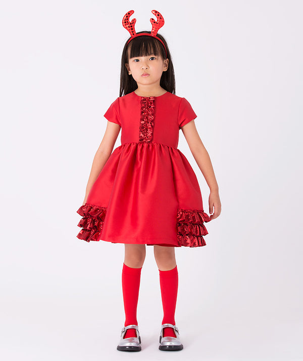 Girl wearing Mama Luma’s Exquisite Ruffles Dress in metallic red with layered ruffles — perfect for Christmas parties, holiday portraits, and winter celebrations. Available in girls’ sizes 3–12 Y.