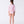 Carica l'immagine nel visualizzatore Galleria, Girl seen from the back wearing a Mama Luma pink polka-dot long-sleeve rash guard swimsuit with ruffle waist and matching swim shoes. Perfect for pool days, beach vacations, and summer fun. Available in girls’ sizes 3–12 years.
