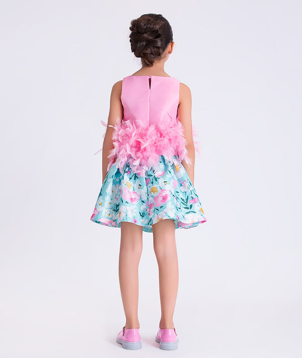 Back view of Mama Luma Kohana Feathers girls outfit showing floral skirt and sleeveless top.