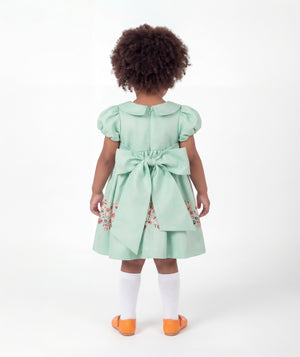 Back view of Marambaia Baby Dress in mint green for babies ages 1 to 3, showing the silhouette and refined construction