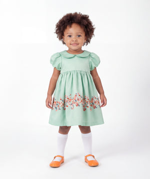 Front view of Marambaia Baby Dress in mint green for babies ages 1 to 3, a premium children’s design by Mama Luma