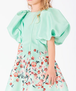 Close-up of Marambaia Girls Dress in mint green for girls ages 3 to 12, highlighting fabric texture and designer details