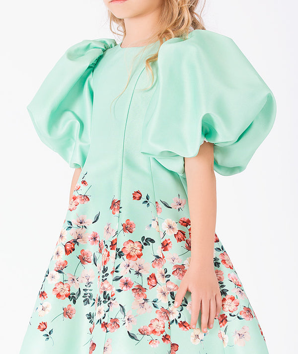 Close-up of Marambaia Girls Dress in mint green for girls ages 3 to 12, highlighting fabric texture and designer details