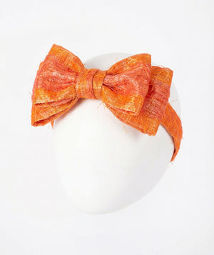 Front view of Matching Feathers Headband in orange feather, a premium children’s design by Mama Luma