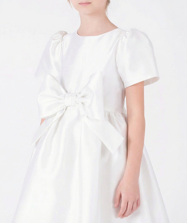 Close-up of Mikado Satin Girls Bow Dress in ivory mikado satin for girls ages 3 to 12, highlighting fabric texture and designer details