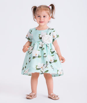 Mint floral baby dress featuring a 3D flower appliqué, by Mama Luma