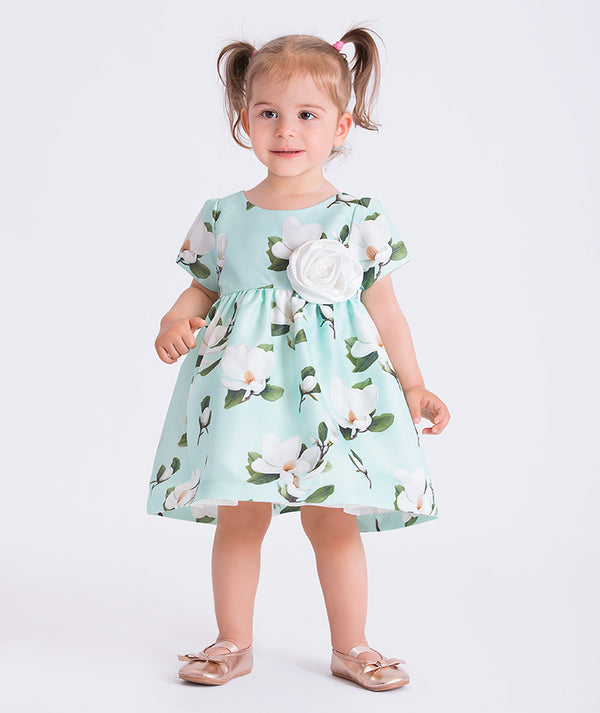 Mint floral baby dress featuring a 3D flower appliqué, by Mama Luma