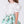 Load image into Gallery viewer, Close-up detail of a mint green floral girls occasion outfit featuring a white puff sleeve top with statement shoulder detail and a matching flared skirt, designed for birthdays, weddings, and special celebrations, available in sizes 3–12
