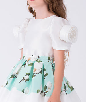Close-up detail of a mint green floral girls occasion outfit featuring a white puff sleeve top with statement shoulder detail and a matching flared skirt, designed for birthdays, weddings, and special celebrations, available in sizes 3–12