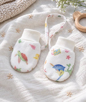 Soft baby mittens in a product photograph, view one.
