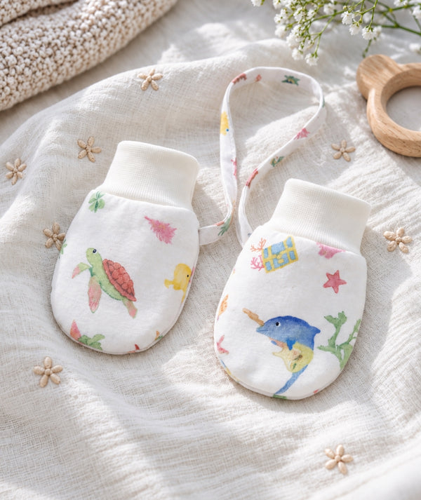 Soft baby mittens in a product photograph, view one.