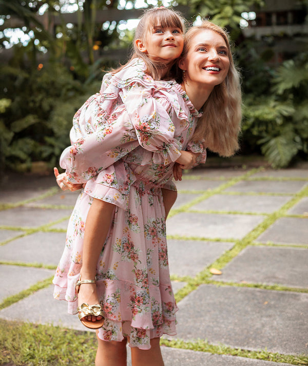 Elegant matching mommy-and-me outfits — Mama Luma pink floral ruffle dresses styled for weddings, luxury flower girl looks, and elegant occasions