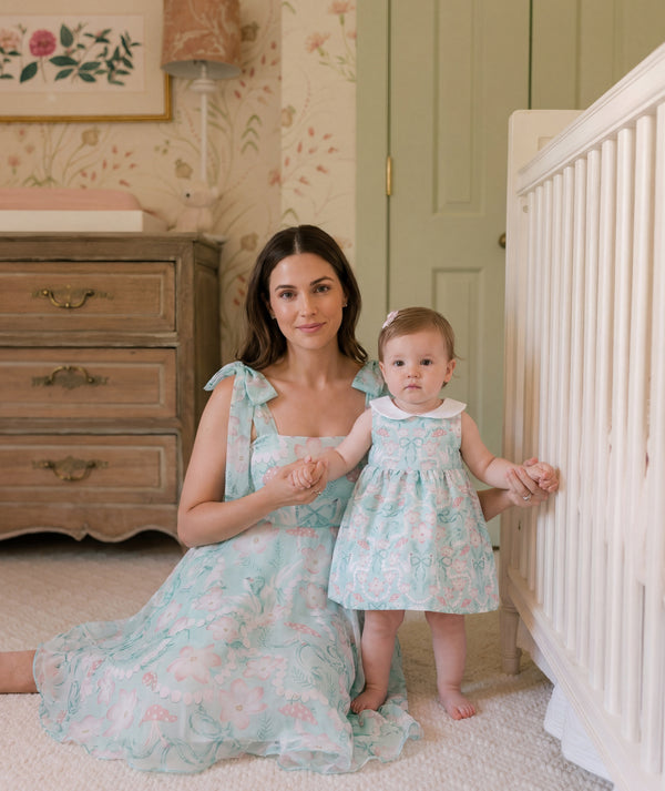 Mother and daughter in matching mint floral dresses