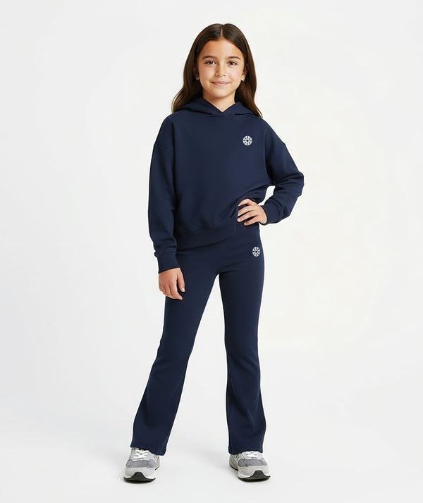 Girl wearing a navy hoodie and matching pants, styled for everyday athleisure, school days, and active play, available in sizes 3–14