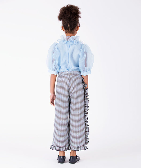 Back view of powder blue girls organza blouse with sheer puff sleeves and layered ruffle neckline by Mama Luma