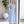 Carica l'immagine nel visualizzatore Galleria, Back view of Organza Ruffles Women's Dress showing its blue organza finish with refined designer construction
