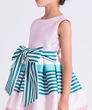 Detail view of Pastel Stripes Girls Dress with oversized striped bow and pastel color accents by Mama Luma