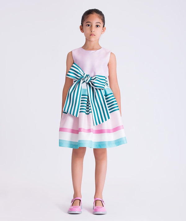 Pastel Stripes Girls Dress featuring a pastel pink bodice, striped skirt, and statement bow from Mama Luma's Kohana Collection