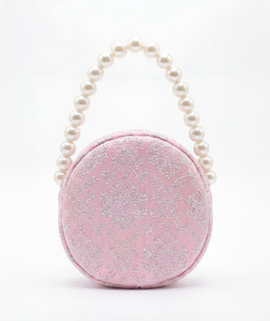 Front view of Pearl Handle Bag in soft pink jacquard, styled as premium children’s special occasionwear
