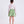 Load image into Gallery viewer, Back view of a two-piece girls outfit with floral blouse and pleated skirt, designed for family celebrations and polished daytime events.
