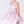 Load image into Gallery viewer, Close-up of the bow and layered bodice on a pink girls party dress, ideal for weddings, birthdays, and special occasions for ages 3–12.
