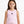 Charger l'image dans la galerie, Front-facing close-up of a girl wearing a pink sleeveless ribbed tank top with a minimalist chest emblem, styled for warm-weather comfort, everyday movement, and soft athleisure wear, available in sizes 3–14
