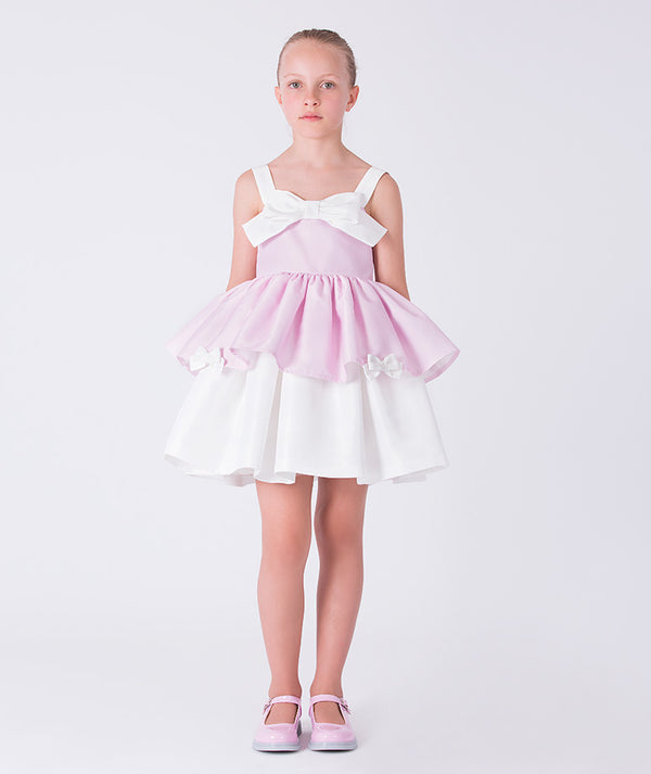 Front view of a pink layered girls dress with bow detail, designed for flower girl moments, parties, and elegant celebrations for ages 3–12.