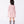 Load image into Gallery viewer, Back view of the Pink Rosette girls blouse (3–12Y) highlighting the clean crew neck silhouette and comfortable jersey fit.
