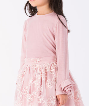 Close-up detail of the 3D rosette cuff on the Pink Rosette girls blouse, showcasing the soft pink fabric and intricate floral design for ages 3–12.