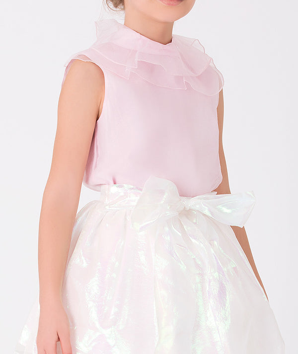 pink blouse and shimmering ecru skirt