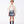 Load image into Gallery viewer, Front view of Pleated Plaid Girls Outfit featuring an ivory ruffled blouse and pleated plaid shorts for girls ages 3 to 12 by Mama Luma.
