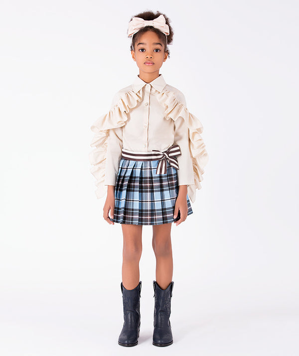Front view of Pleated Plaid Girls Outfit featuring an ivory ruffled blouse and pleated plaid shorts for girls ages 3 to 12 by Mama Luma.