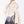 Load image into Gallery viewer, Detail view of Pleated Plaid Girls Outfit with ivory ruffled blouse, striped waist bow and powder-blue plaid shorts by Mama Luma.
