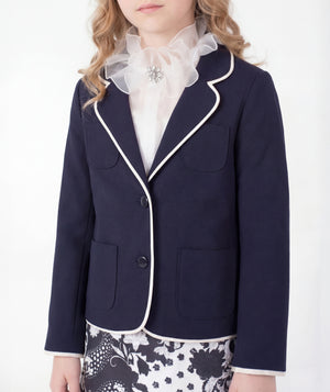 Close-up of Ponte-Knit Piped Girls Blazer in ivory ponte knit for girls ages 3 to 12, highlighting fabric texture and designer details