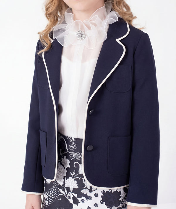 Editorial view of Ponte-Knit Piped Girls Blazer in ivory ponte knit for girls ages 3 to 12, styled for weddings, birthdays and special occasions, image 2