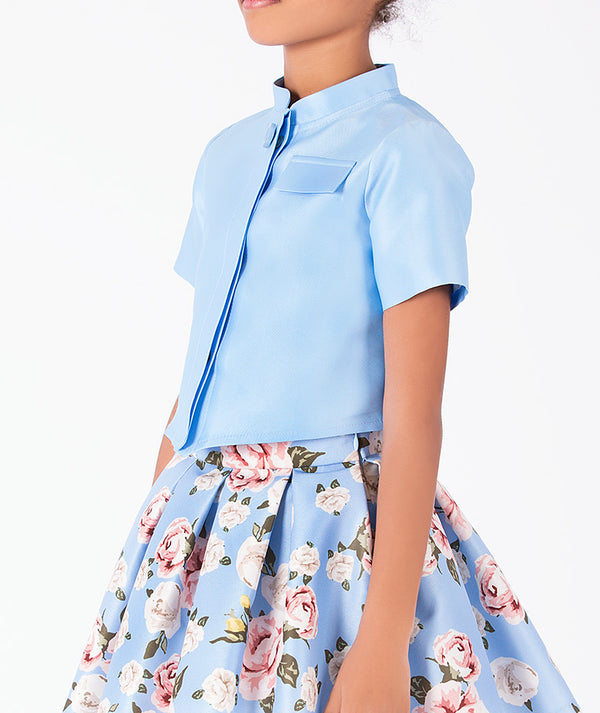 Porcelain Garden girls outfit with powder blue cropped jacket and pink rose floral pleated skirt detail
