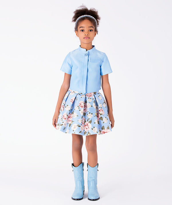 Porcelain Garden girls two-piece outfit with powder blue cropped jacket and rose print pleated skirt front view