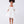 Load image into Gallery viewer, Front view of ivory girls dress with pearl beaded puff sleeves, square neckline and statement waist bow.
