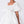 Load image into Gallery viewer, Close-up of pearl embellished puff sleeve on ivory girls occasion dress with structured bodice.
