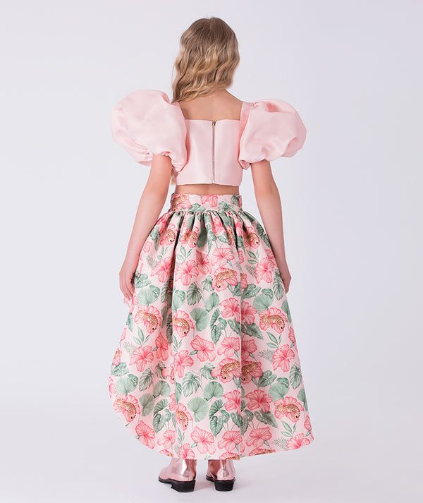 Front view of the Puff Sleeve High-Low Skirt Outfit featuring a puff-sleeve crop top and floral high-low skirt, crafted from premium lightweight fabric with cotton lining, designed for girls ages 3–12 for parties, birthdays, and festive occasions.