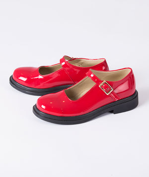 Red patent leather girls Mary Jane shoes with buckle strap and low heel, designed for special occasions, holiday outfits, school events, and polished everyday wear, available in kids’ sizes