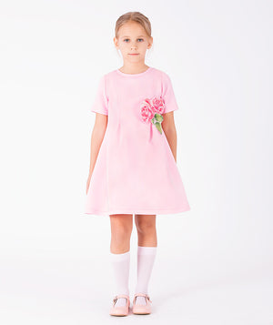 Front view of Rose Appliqué Girls Dress in blush pink structured fabric for girls ages 3 to 12, showing overall silhouette and styling