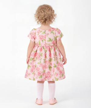 Back view of Rose Bloom Baby Dress in blush pink satin for babies 12 to 36 months, highlighting neckline, sleeves and embellishments
