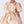 Carica l'immagine nel visualizzatore Galleria, Close-up of gold satin girls dress featuring floral shoulder appliqué and oversized waist bow detail.
