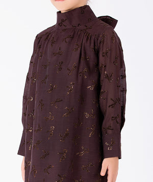 Detail view of Shimmering Mocha Girls Dress with metallic bow accents and high neckline for girls ages 3 to 12 by Mama Luma.