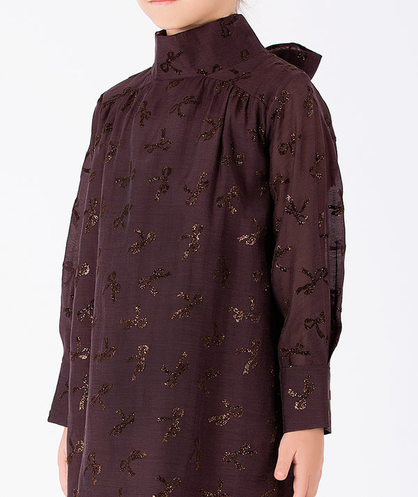 Detail view of Shimmering Mocha Girls Dress with metallic bow accents and high neckline for girls ages 3 to 12 by Mama Luma.