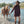 Carica l'immagine nel visualizzatore Galleria, Shimmering Mocha Women's Dress styled beside a horse in an outdoor riverside editorial setting.
