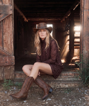 Shimmering Mocha Women's Dress with delicate bow embellishments styled for an elevated Western-inspired look.